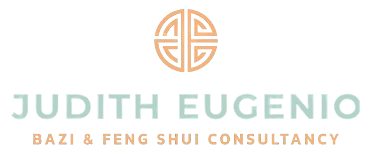 Logo with a circular design above the text: "Judith Eugenio Bazi & Feng Shui Consultancy.